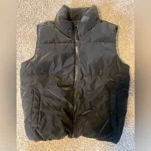 Shimmery zip up puffy vest.  Matte black color with a slight sheen - very cool!